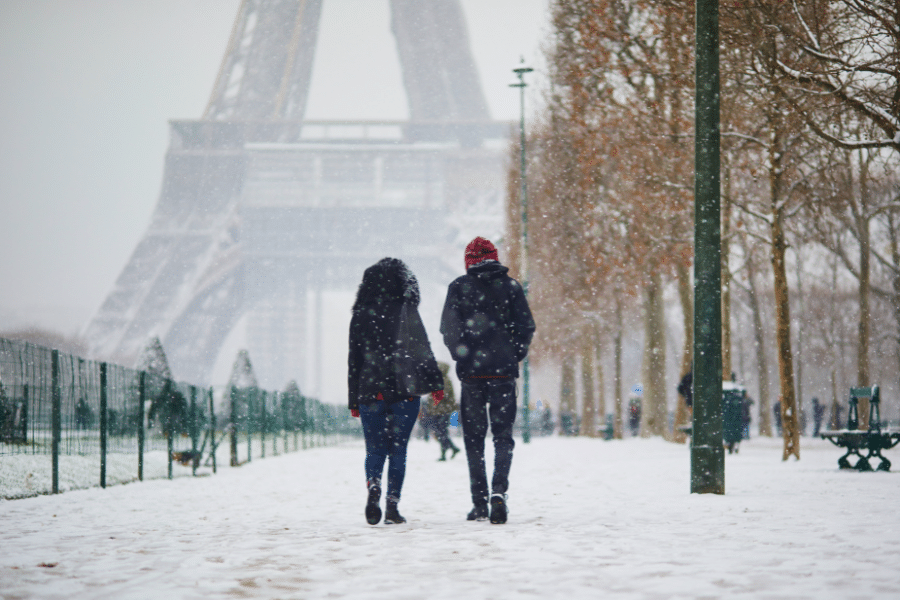 Couple walking in winter in Paris France